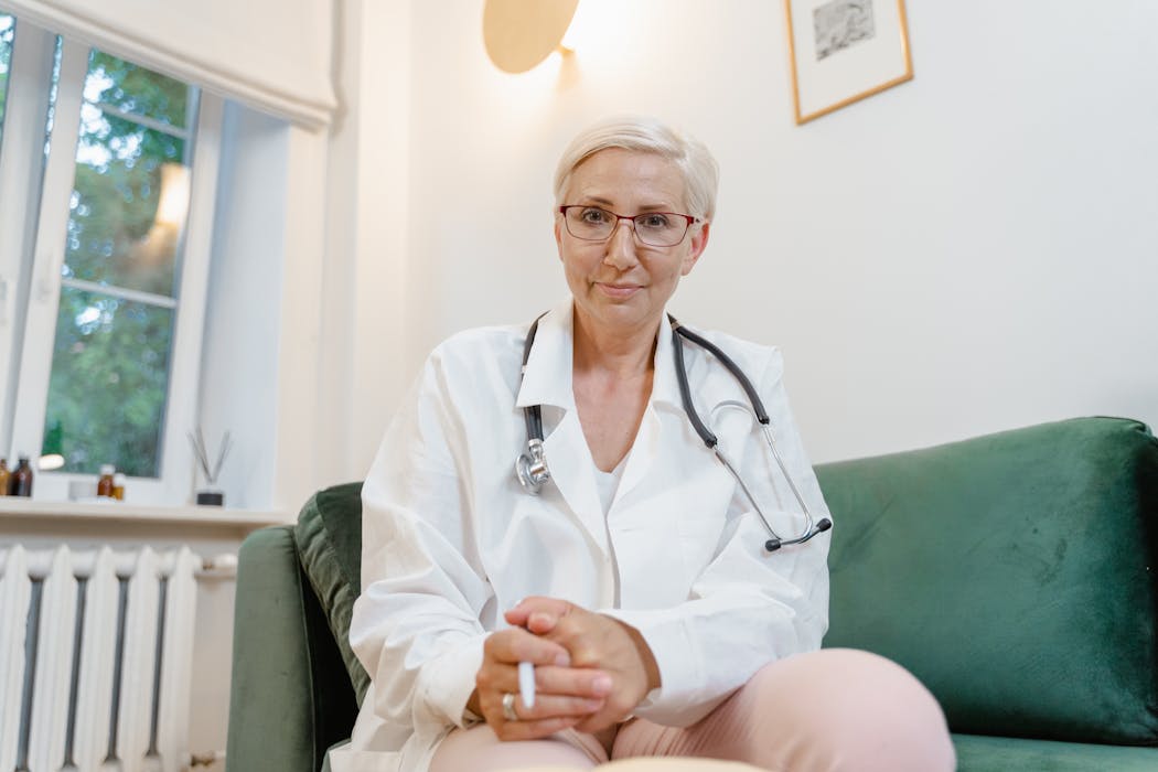 Doctor consulting with patient during a compassionate home visit